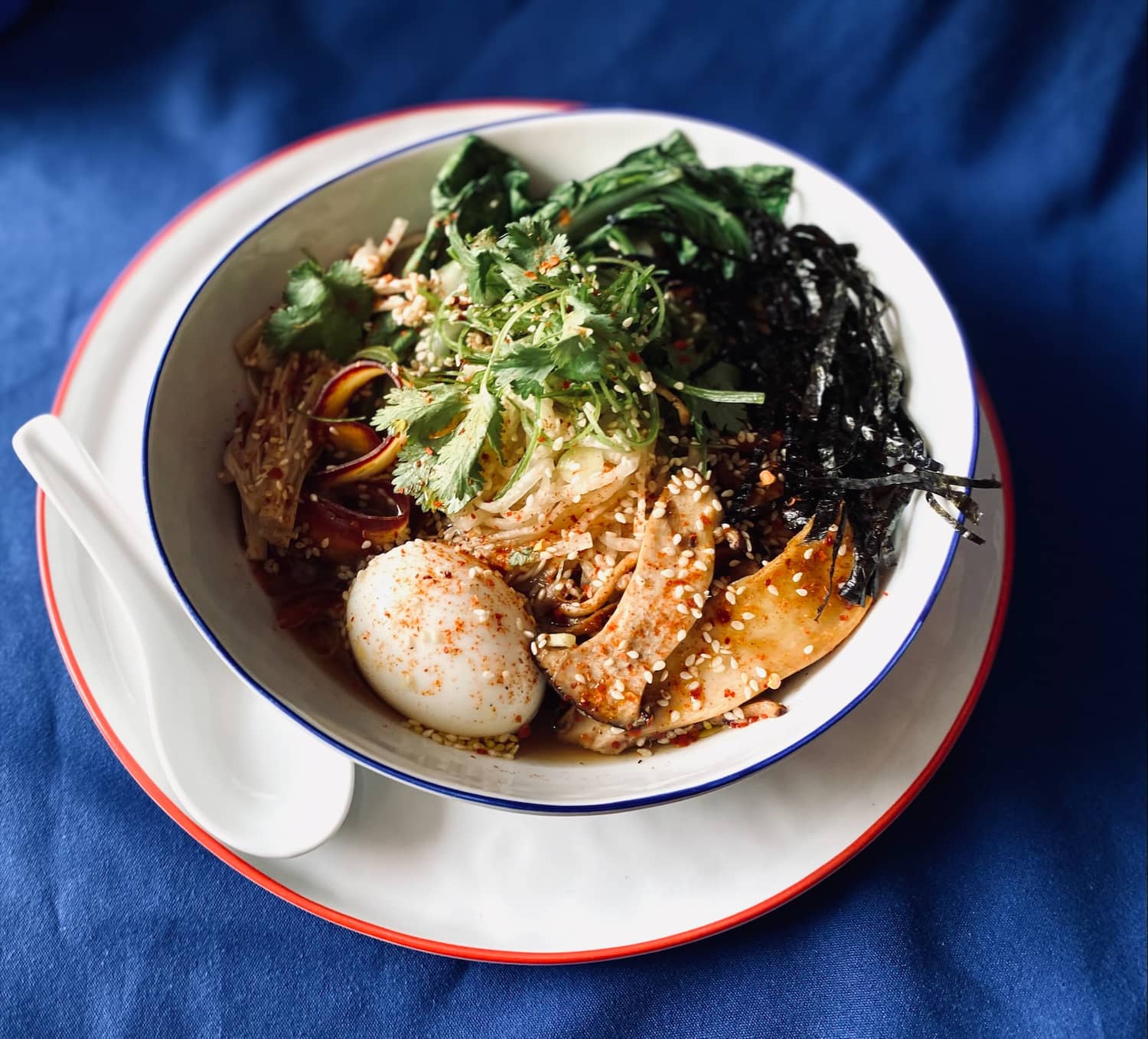 Bowl of ramen with mushrooms, eggs & variety of vegetables