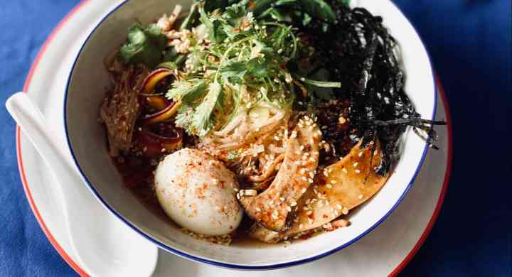 Bowl of ramen with mushrooms, eggs & variety of vegetables