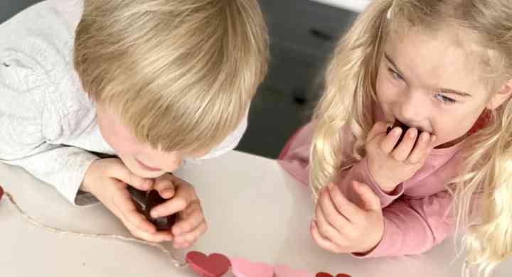 2 kids enjoying heart-shaped brownies