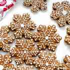 Gingerbread people-shaped cookies, with white icing decorations.